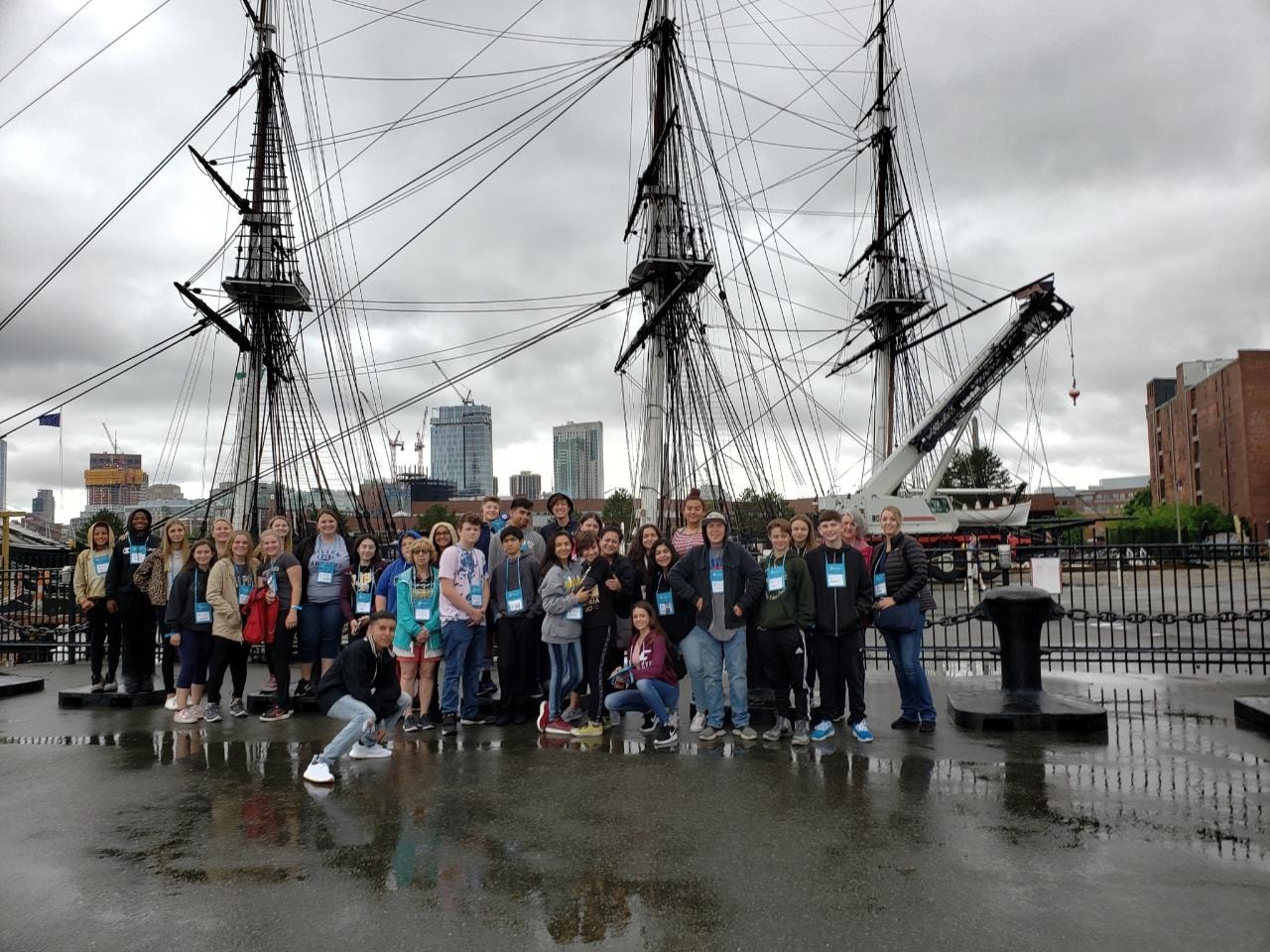 Group of students in front of a ship