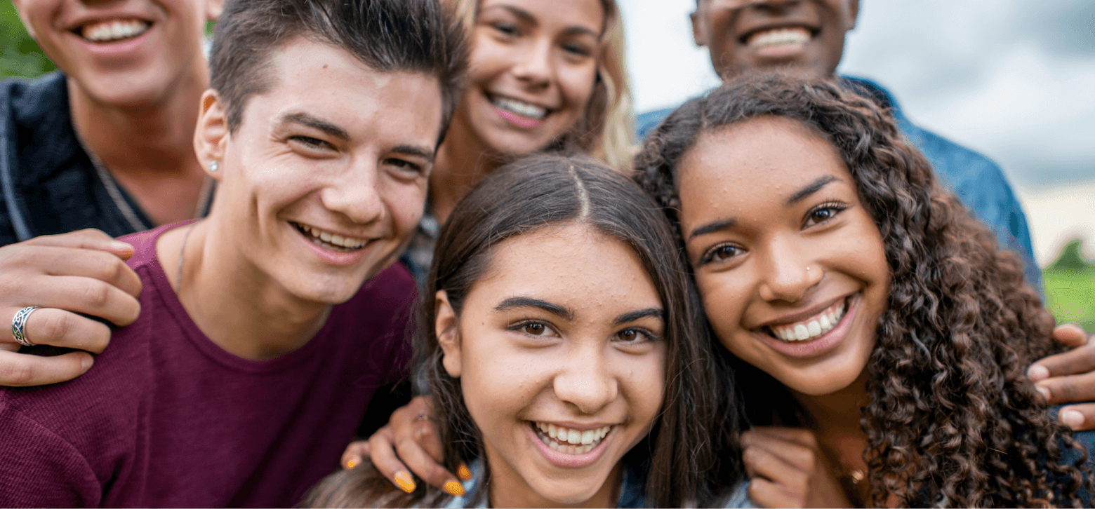 Group of teenage students smiling