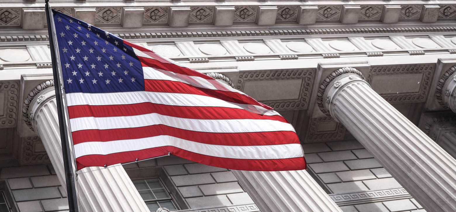 American Flag hanging by a building