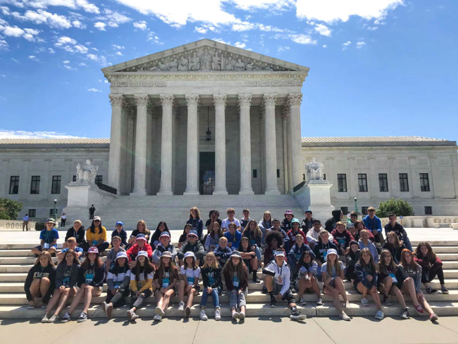 Large group of students gathered on the steps outside of the Lincoln Memorial