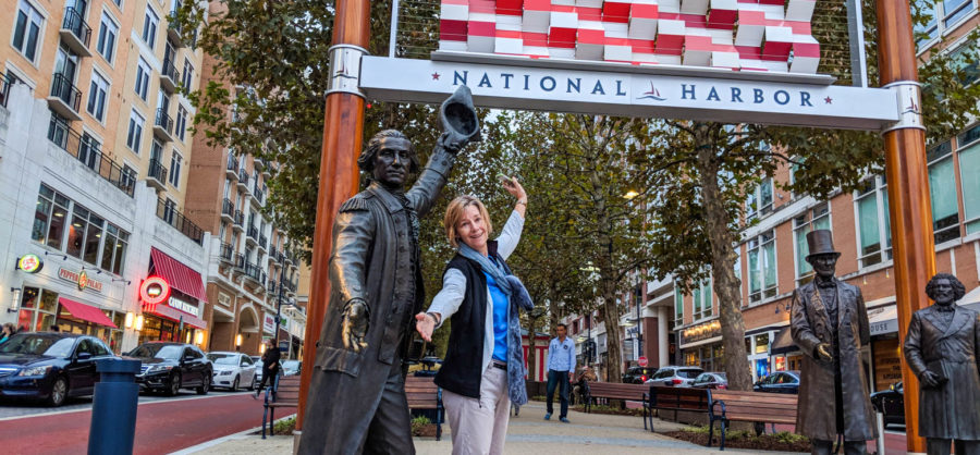 Teacher posing with a statue in Philadelphia