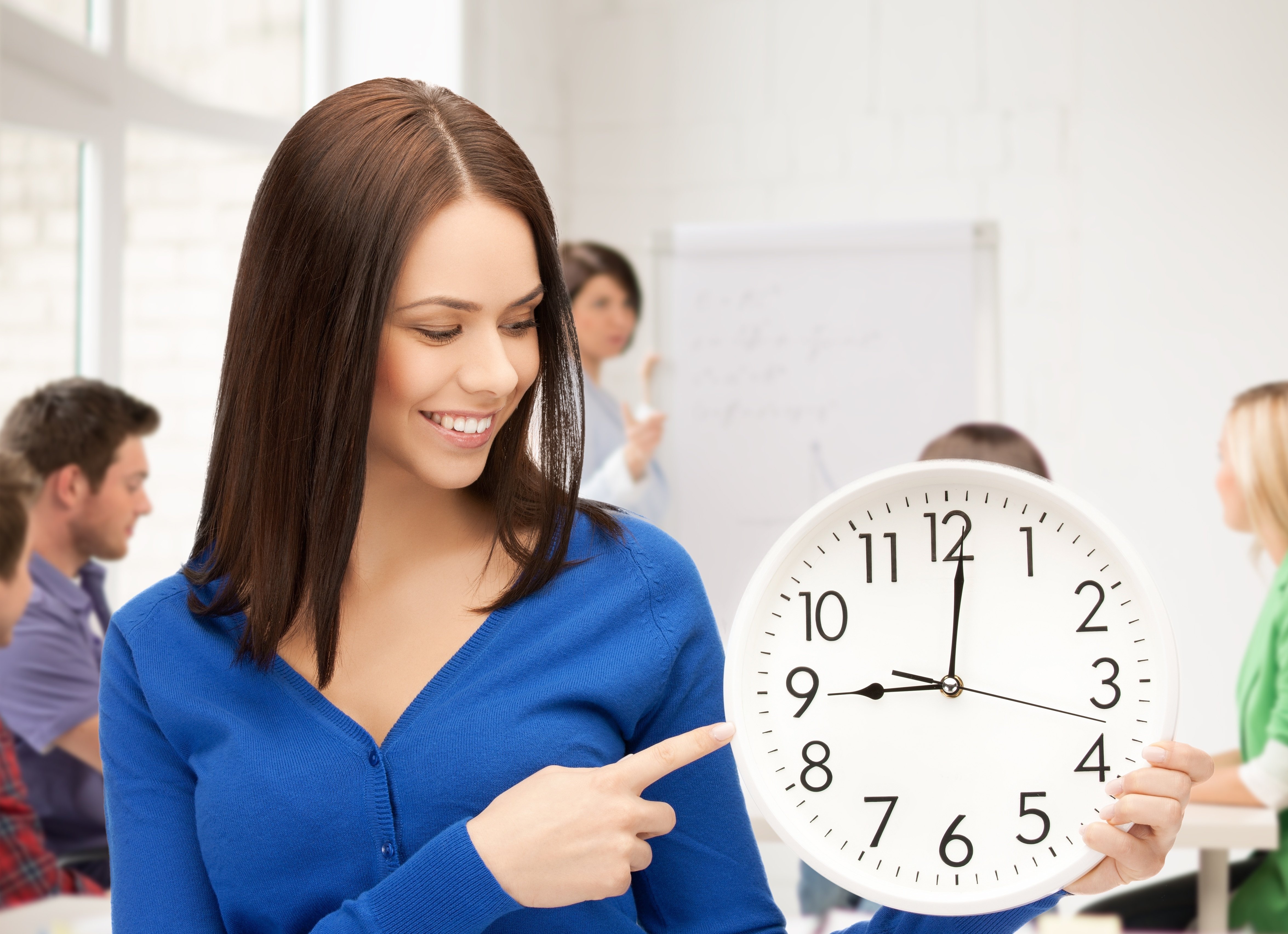 TeacherWithClock.jpg