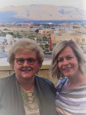 two women smiling at the camera