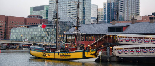 Boston harbor with historical ship