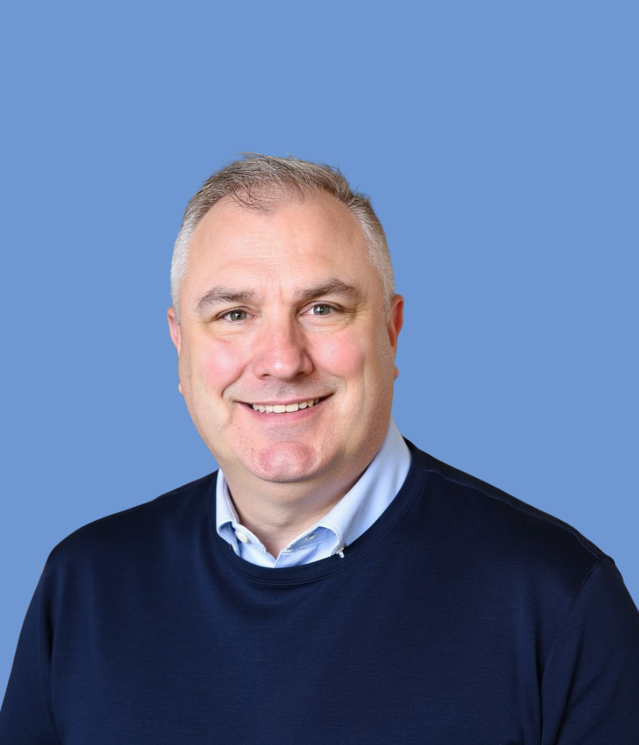 Portrait of Jay B, CEO and Founder, on a blue background